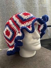 a crocheted hat with red, white and blue stripes
